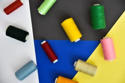 Threads on a multi-colored background Stock Photos