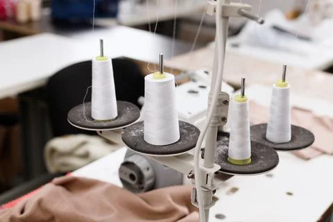 Threads with an overlock machine at work Foto stock