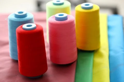 Threads for sewing on coils Stock Photos