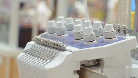 Threads on a sewing machine in loops from spools during automatic operation. Stock Footage 267008125