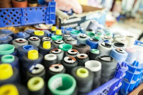 Threads for sewing in a workshop. it is a lot of threads for sewing in a box Stock Photos