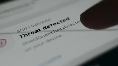 Threat detected warning displayed by device security application Stock Footage 335459022