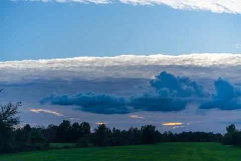 Threatening cloud formations  in the sky from the coming storm, while the blu Stock Photos