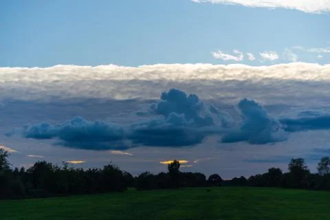 Threatening cloud formations  in the sky from the coming storm, while the blu Stock Photos