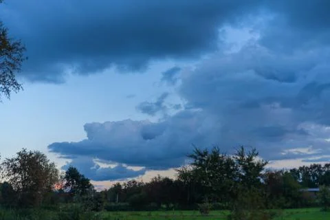 Threatening cloud formations  in the sky from the coming storm, while the blu Stock Photos