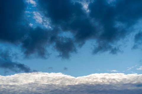 Threatening cloud formations  in the sky from the coming storm, while the blu Stock Photos
