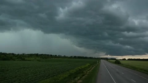 Threatening storm clouds ahead of the road Video stock 149276073