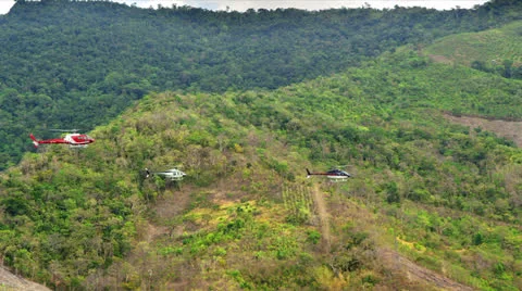 Three (3) Helicopters  flying over the mountain ranges of Palawan Philippines 스톡 동영상 25715813