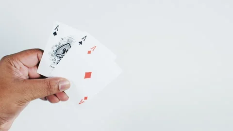 Three Aces in man's hand during a poker game Stock Footage 248754476