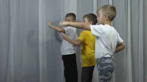 Three active boy athlete train punches Stock Footage 143186960