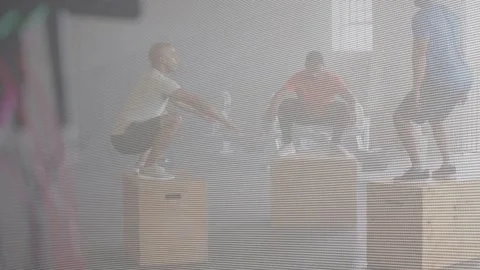 Three adult men briefly pausing then starting fitness circuit, alternating box Stock Footage 334203933