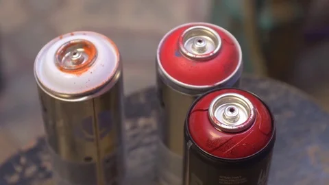 Three aerosol cans,, defocus to focus Video stock 81934768