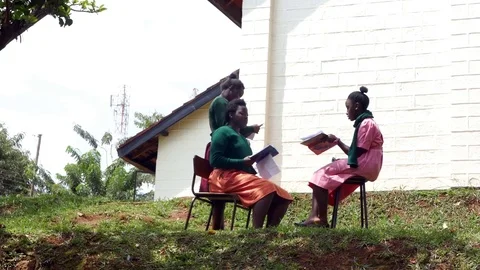 Three African black female students are studying and talking  in garden Stock Footage 85132422