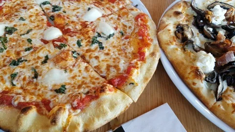 Three all dressed pizzas 動画素材 87719425