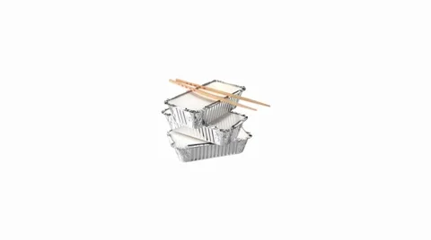 Three aluminium take-away food containers and chopsticks Stock Footage