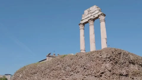Three Ancient Temple Columns at Roman Forum Under Blue Sky 스톡 동영상 338008690