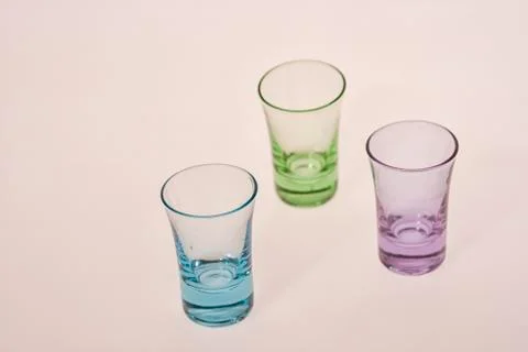 Three antique colored glasses Stock Photos