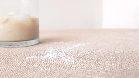 Three ants and sugar  on a brown tablecloth Stock Footage 146251069