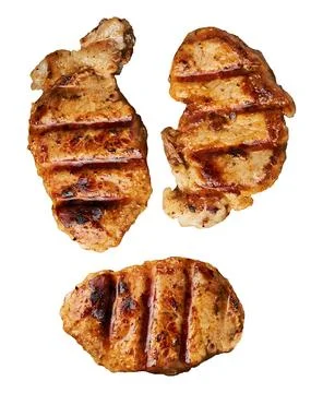 Three appetizing grilled pork steaks with grill marks Stock Photos