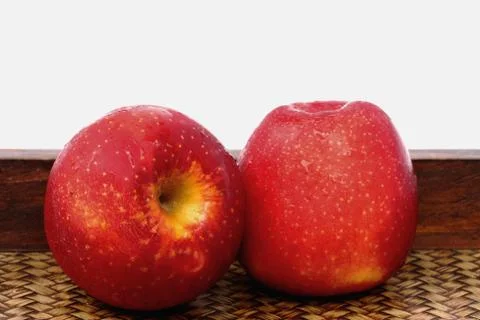 Three apples on bamboo Stock Photos