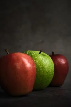Three apples on a dark background Foto stock