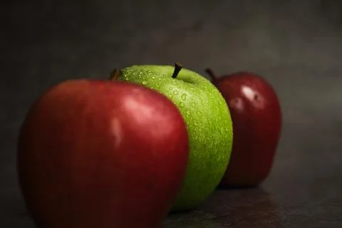 Three apples on a dark background 스톡 사진