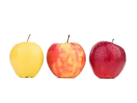 Three apples in different colors on a white background Stock Photos