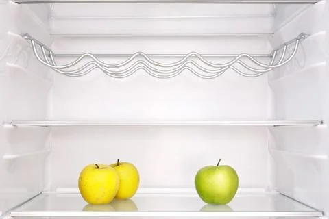 Three apples in refrigerator Stock Photos