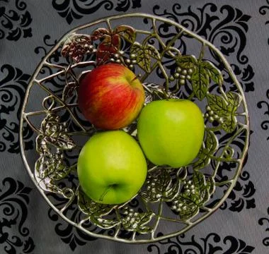 Three apples on a silver platter Stock Photos