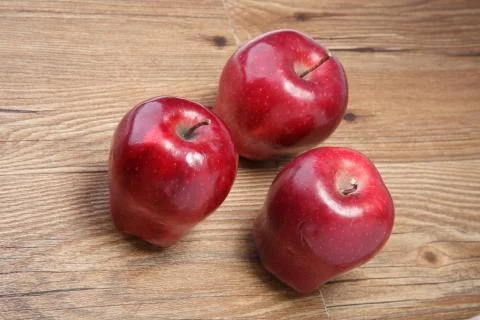 Three apples on the table Stock Photos
