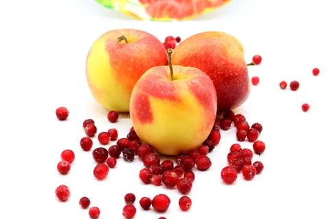 Three apples on a white background and ice cream cranberries 스톡 사진
