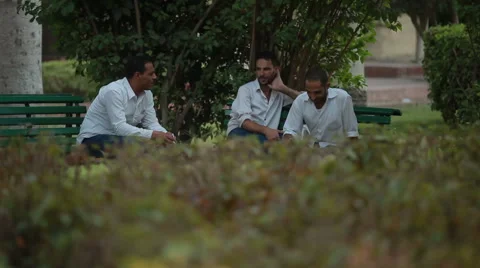 Three  Arabic Looking People Talking Stock Footage 58499009