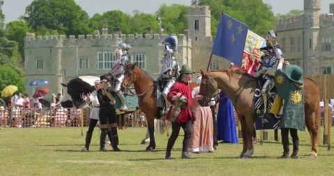 Three armored knights line up during Queen's Joust ceremony Stock Footage 340255498