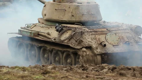 Three Armoured military Tanks driving through the mud. Army vehicles Stock Footage