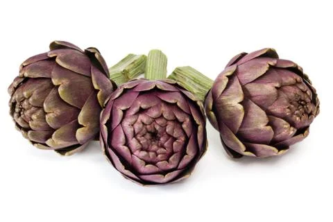 Three artichokes on white background Foto stock