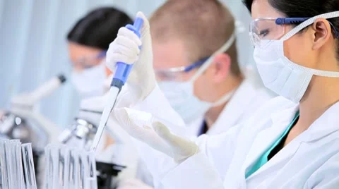 Three Assistants in Medical Research Laboratory Stock Footage