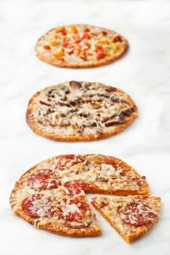 Three Assorted Pizzas; On White Stock Photos