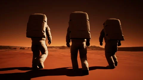 Three astronauts in spacesuits confidently walk on Mars in search of life Stock Footage 94192335