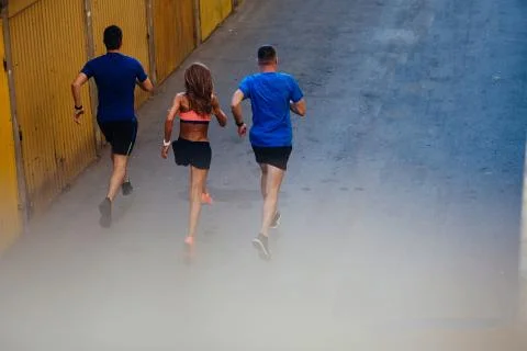 Three athletes jogging Stock Photos