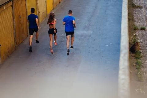Three athletes jogging Stock Photos