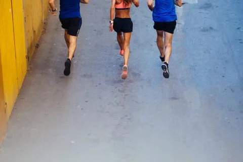 Three athletes jogging Stock Photos