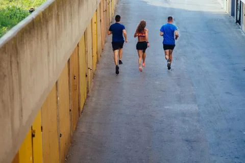 Three athletes jogging Stock Photos