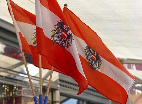 Three Austrian flags with eagles Stock Illustration