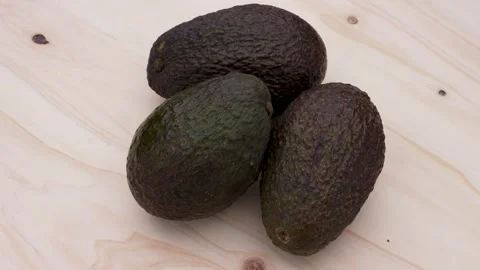 Three avocados turn Stock Footage 301668422