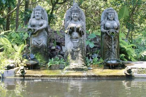 Three Balinese Goddess Stone Statues Water Fountain Garden Ubud Bali Indonesia Stock Photos