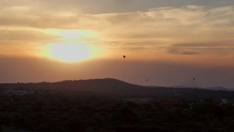 Three ballons floting in the sky at sunset Stock Footage 249110607