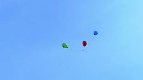 Three balloons flying high in the sky Stock Footage 39986472