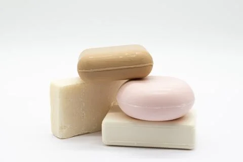 Three bars of soap rest softly against each other Stock Photos