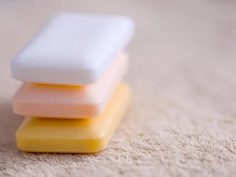 Three bars of soap on a towel 스톡 사진