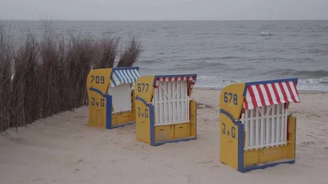 Three beach chairs on the beach with north sea horizon in the background Stock Footage 100106092